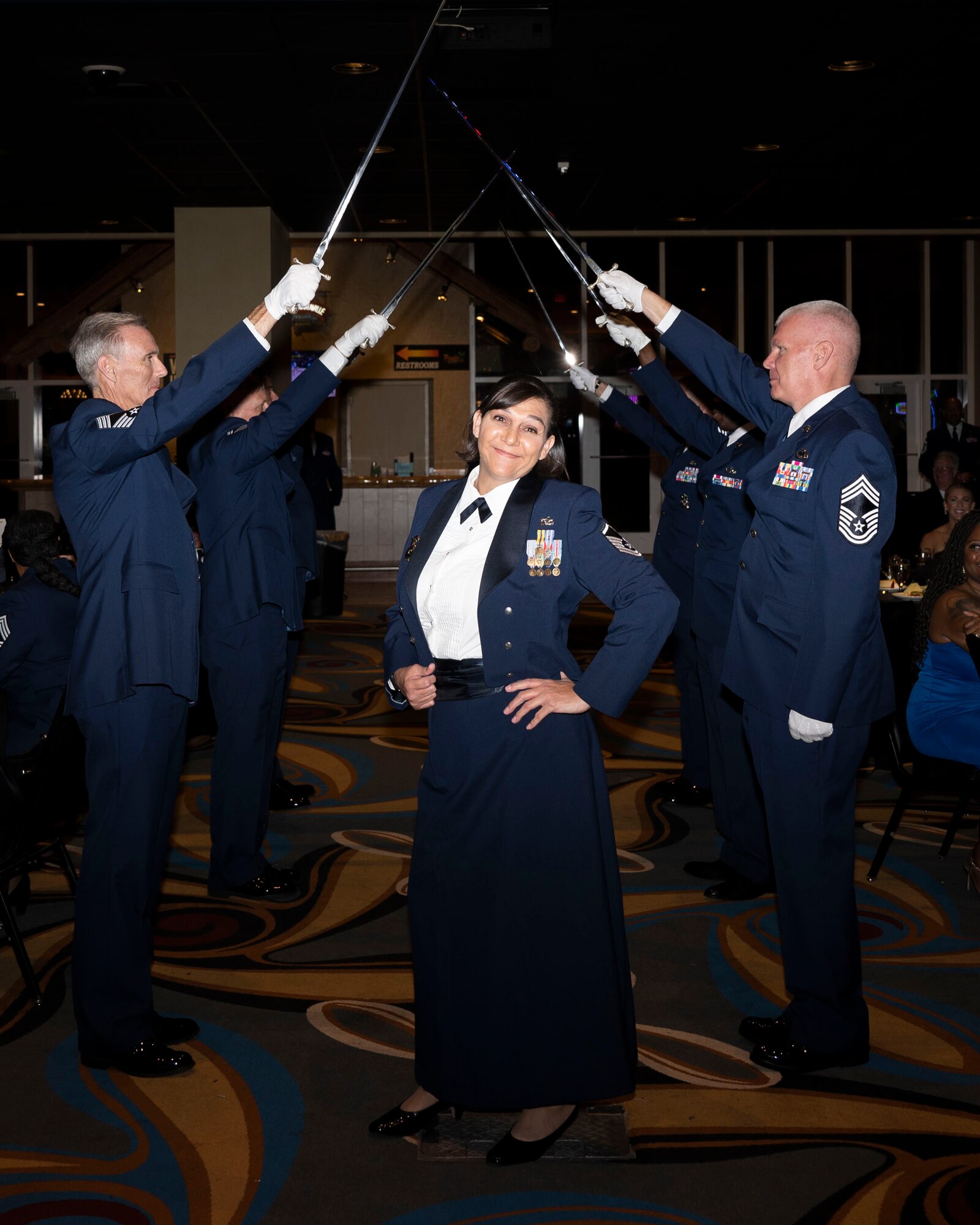 An Airman smiles happily at the camera during a SNCO Induction Ceremony.