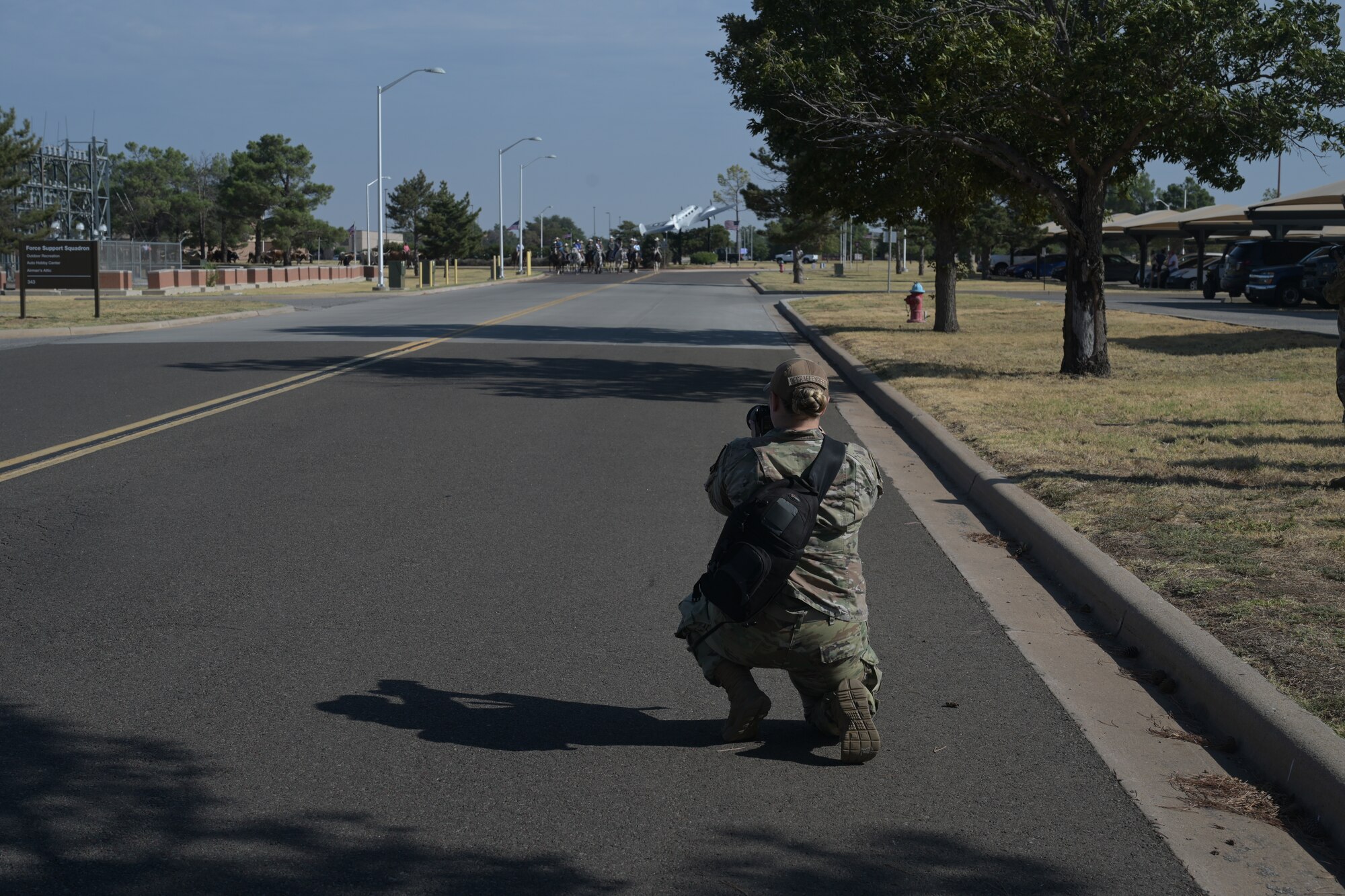 U.S. Air Force Senior Airman Kari Degraffenreed, 97th Air Mobility Wing Public Affairs journeyman, takes photos during the 26th Annual Cattle Drive at Altus Air Force Base, Oklahoma, Aug. 22, 2024. Degraffenreed has served in the Air Force for three years. (Courtesy photo)