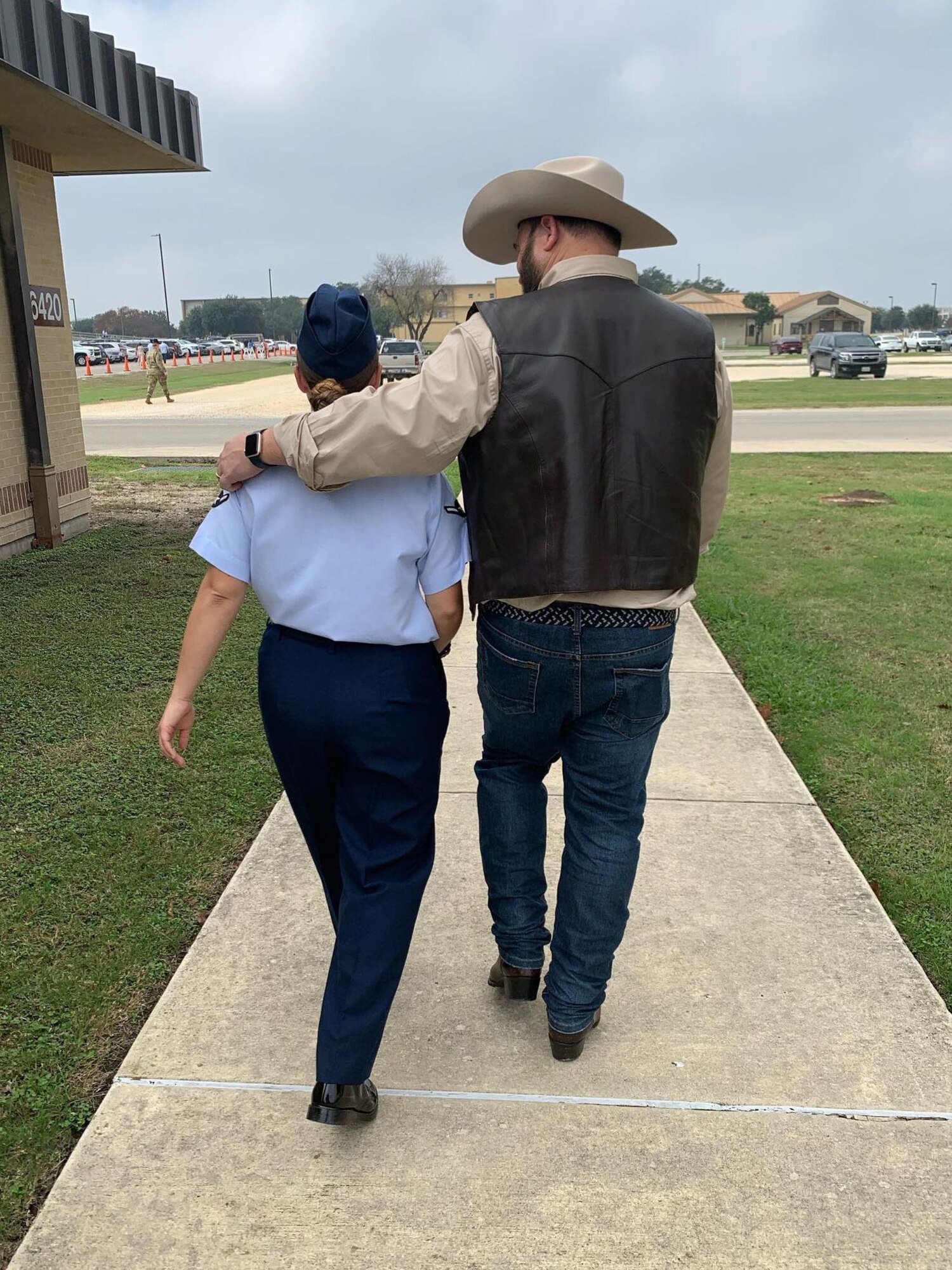 U.S. Air Force Airman Kari Degraffenreed, 97th Air Mobility Wing Public Affairs journeyman, walks with her father, Andrew Degraffenreed, at Joint Base San Antonio-Lackland, Texas, Dec. 29, 2021. Degraffenreed expressed the desire to join the Air Force after learning about the public affairs career field. (Courtesy photo)