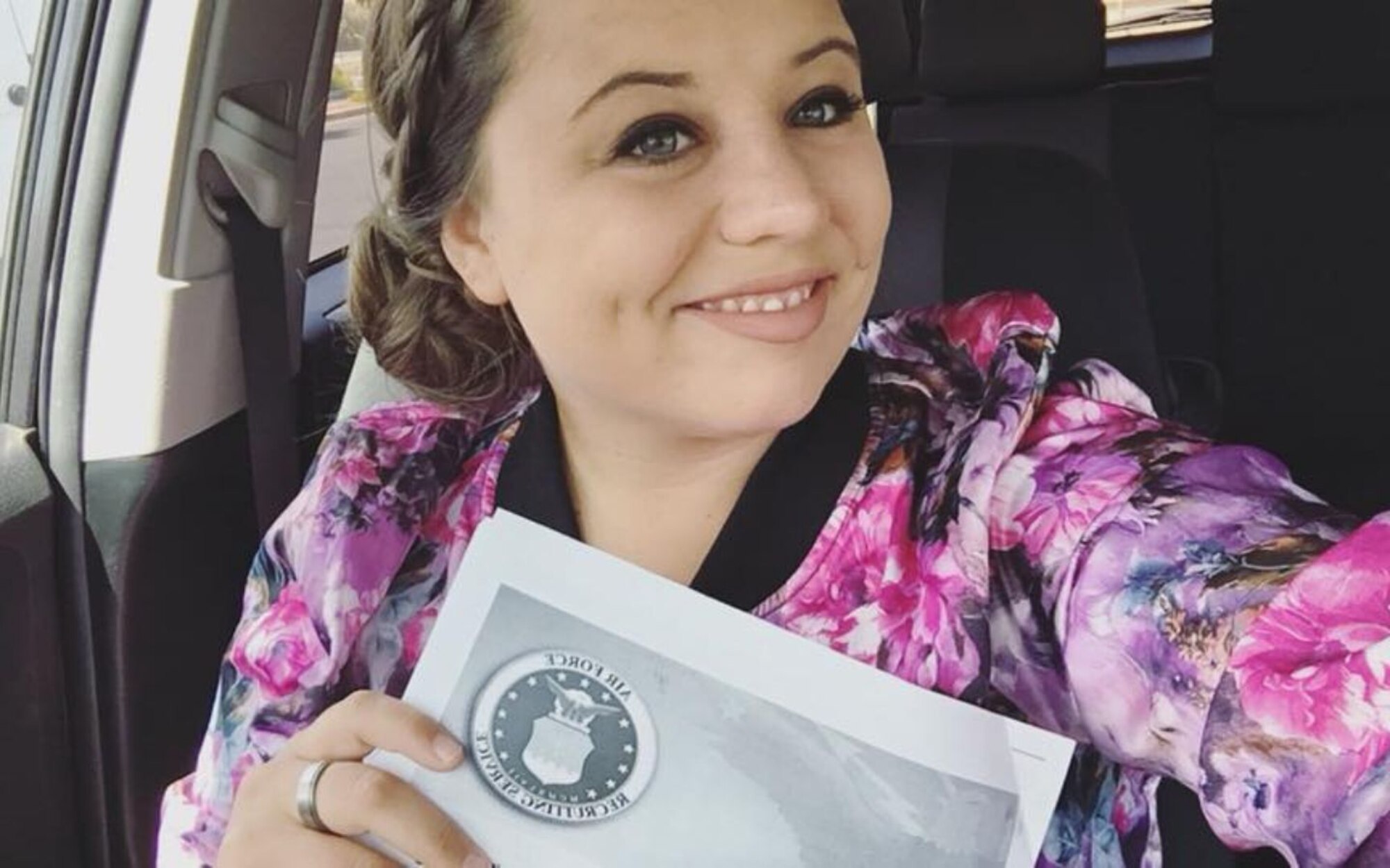 Kari Degraffenreed poses with an Air Force packet in San Diego, California, Aug. 8, 2019. Degraffenreed entered the Air Force Nov. 9, 2021. (Courtesy photo)