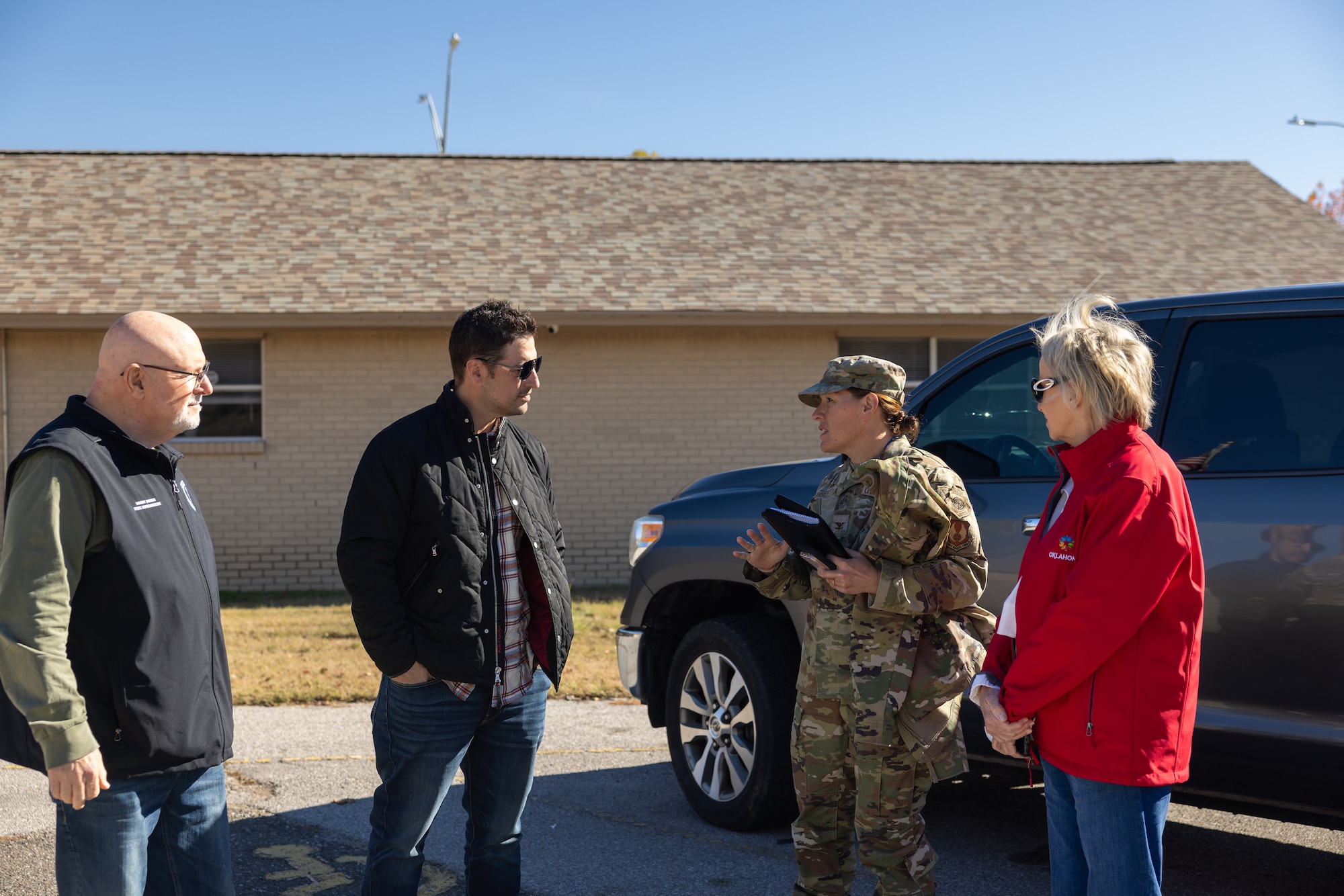 Tinker Installation and 72nd Air Base Wing Commander, Col. Abigail Ruscetta, speaking with the city of Choctaw Mayor, Chad Allcox, alongside State Senator Brenda Stanley and State Representative Robert Manger.