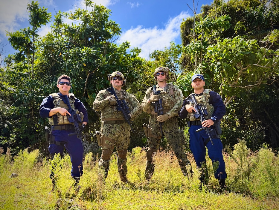The U.S. Coast Guard team, comprised of members from the Forces Micronesia Sector Guam Sector Boarding Team and Port Security Unit 311, stands for a photo prior to the Battle of the Branches joint competitive marksmanship challenge at Andersen Air Force Base on Nov. 22, 2024.