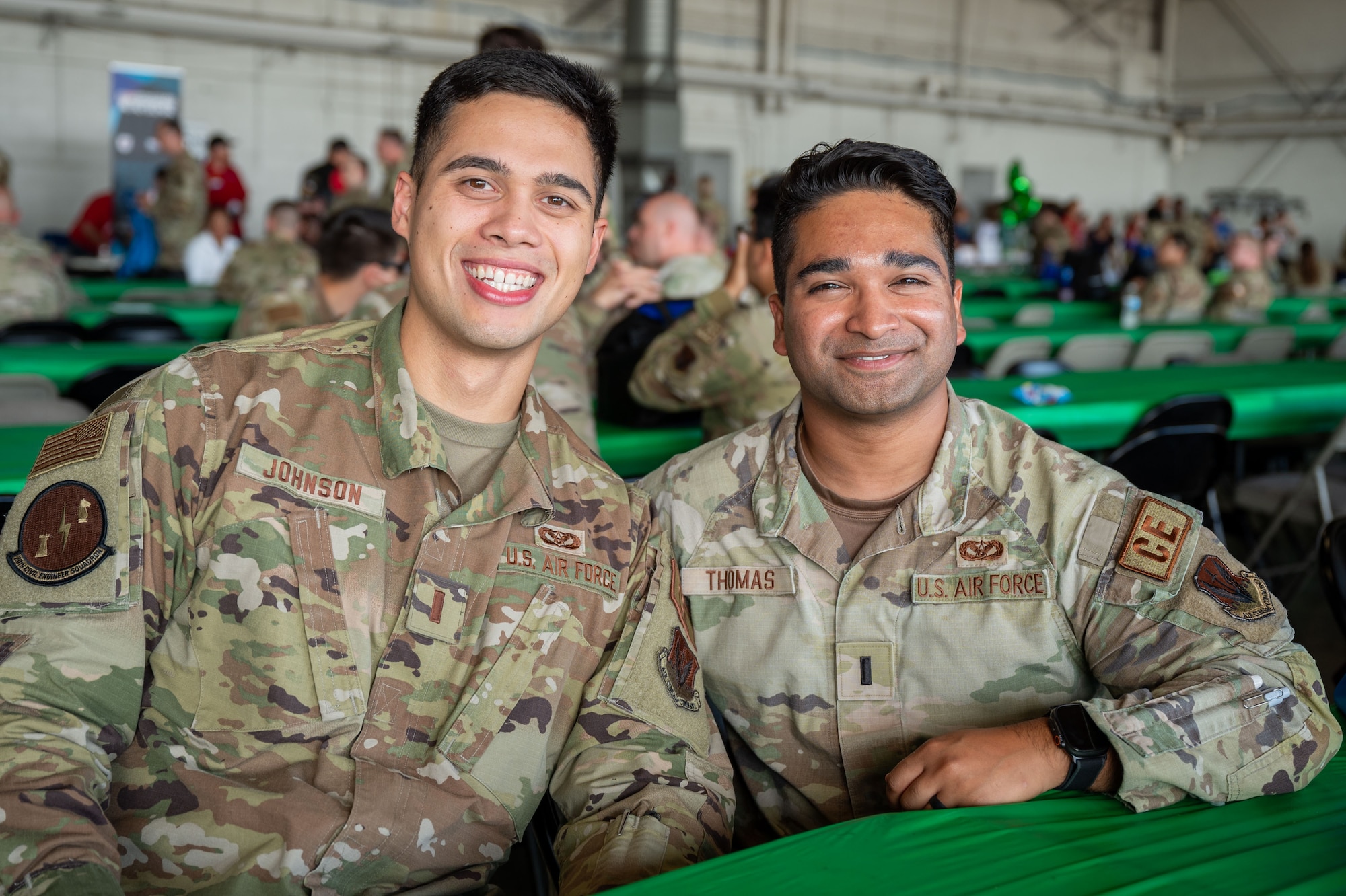 Two men pose for a photo.