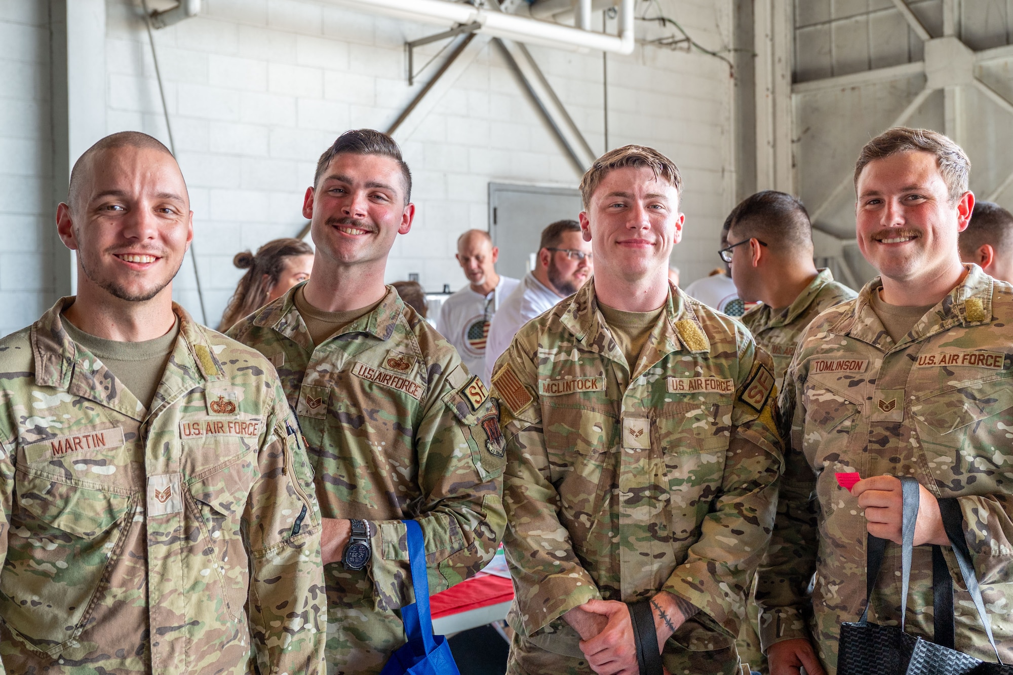 From left, U.S. Air Force Staff Sgt. Scott Martin, 20th Security Forces Combat Arms Training and Maintenance noncommissioned officer in charge, along with Staff Sgt. Jacob Williams, Senior Airman Sean McLintock and Staff Sgt. Winston Tomlinson, all 20th SFS CATM instructors, pose for a photo during the annual Military Appreciation Picnic at Shaw Air Force Base, S.C., Nov. 1, 2024.