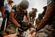 Military medic trains on simulated injury