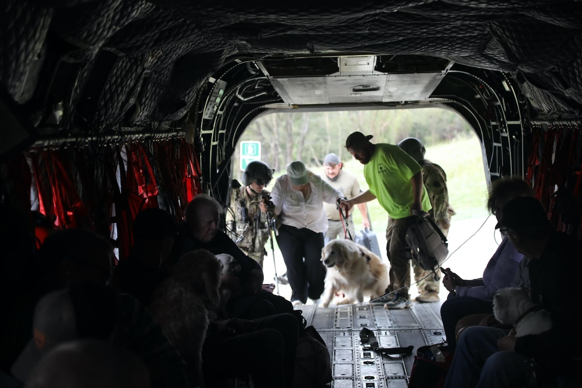 Soldiers assigned to the 2nd Battalion, 104th Aviation Regiment work to airlift stranded citizens from Avery County to Hickory, N.C., in the aftermath of Hurricane Helene, Sept. 29, 2024.