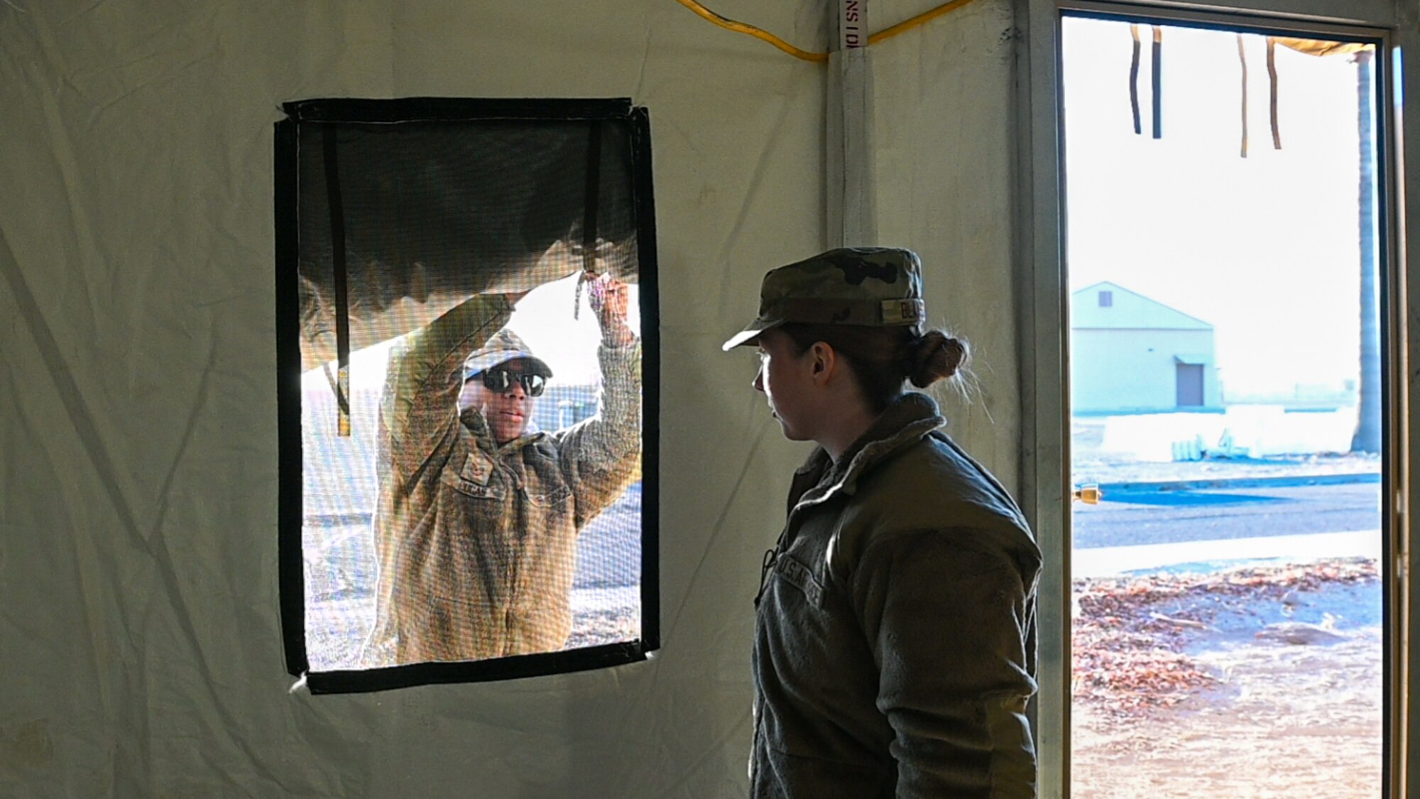 944th Fighter Wing Reserve Citizen Airmen prepare a tent structure during Exercise Desert Hammer 25-1 at Gila Bend Air Force Auxiliary Field in Gila Bend, Ariz., Nov. 14, 2024. Set against the unmatched backdrop of the Barry M. Goldwater Range, Desert Hammer leverages Arizona’s strategic geography to provide realistic combat training for U.S. and allied forces. (U.S. Air Force photo by Senior Airman Alexis Orozco)