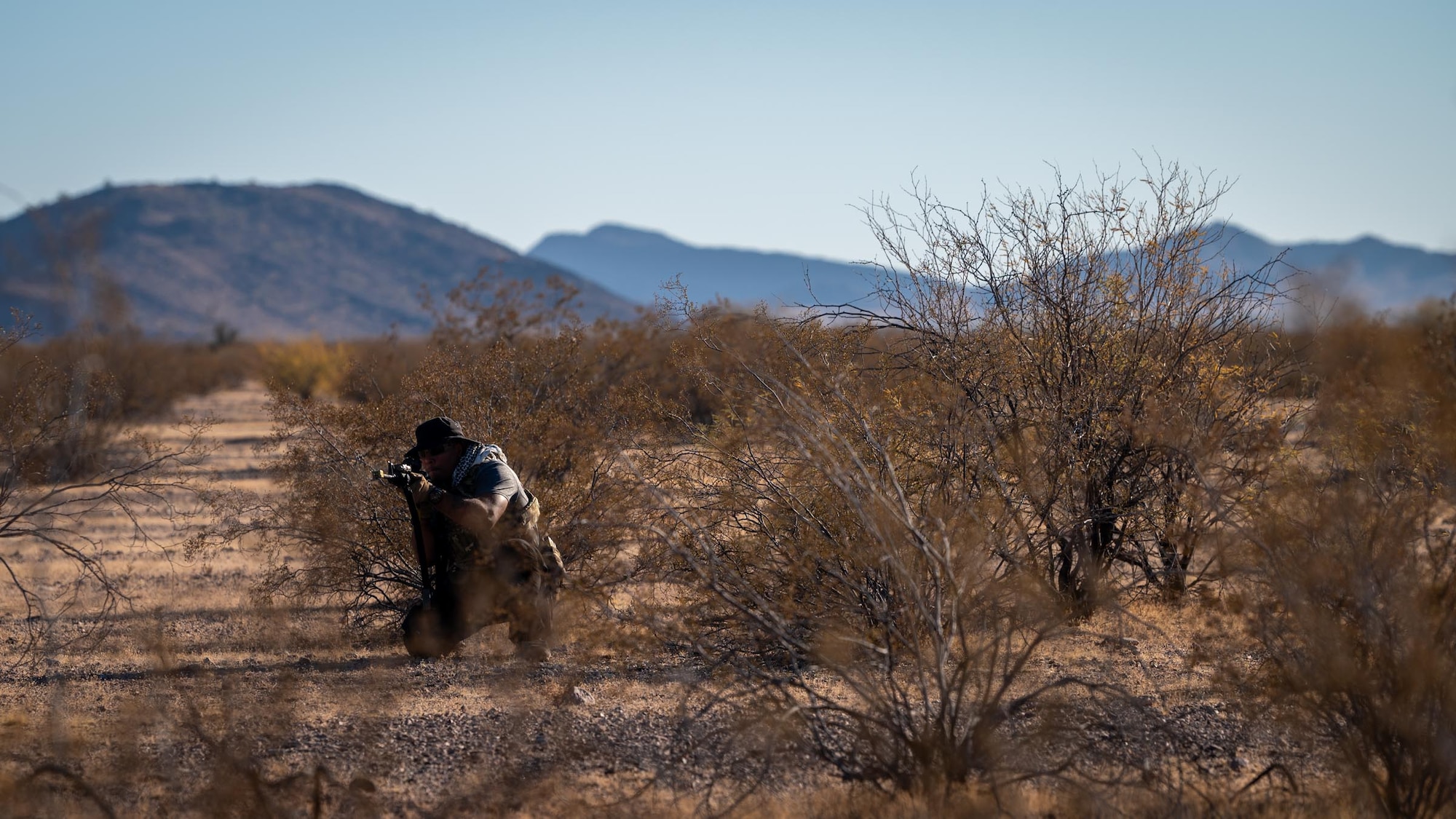 A 944th Fighter Wing Reserve Citizen Airman takes position during a Exercise Desert Hammer 25-1 at Auxiliary Airfield 6 near Gila Bend, Ariz., Nov. 14, 2024. This large-scale exercise showcases the adaptability of Mission Ready Airmen, advancing the skills needed to thrive in the rapidly evolving challenges of global competition. (U.S. Air Force photo by Senior Airman Jacob Dastas)