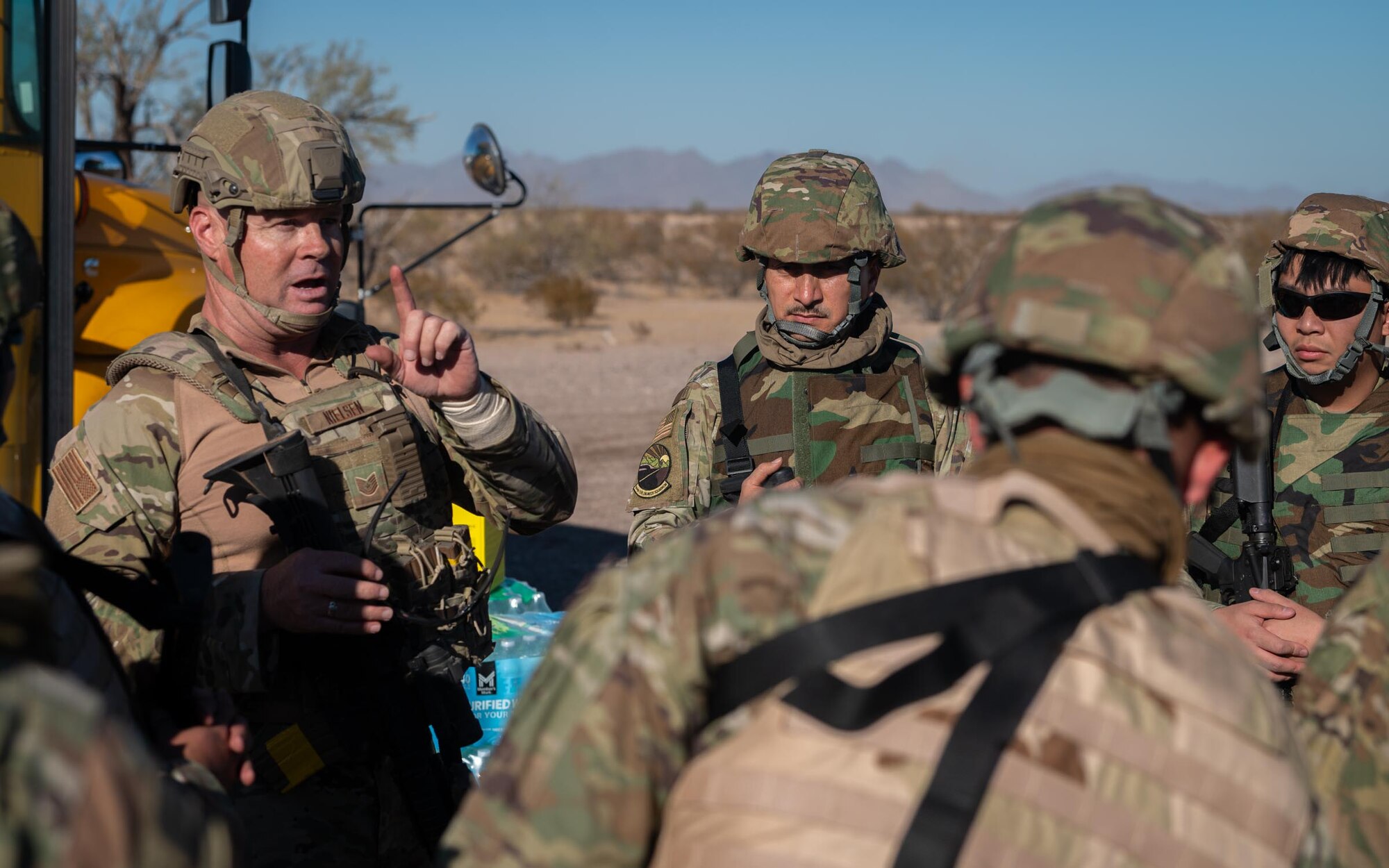 An instructor briefs 944th Fighter Wing Airmen on tactics during Exercise Desert Hammer 25-1 at Auxiliary Airfield 6 near Gila Bend, Ariz., Nov. 14, 2024. Set against the unmatched backdrop of the Barry M. Goldwater Range, Desert Hammer leverages Arizona’s strategic geography to provide realistic combat training for U.S. and allied forces. (U.S. Air Force photo by Senior Airman Jacob Dastas)