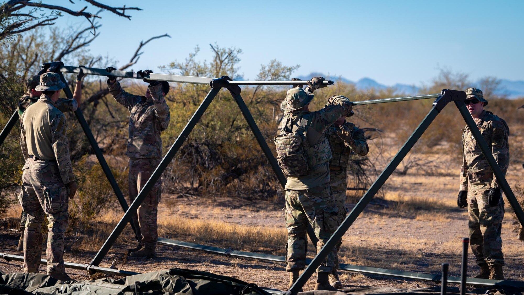 944th Fighter Wing Reserve Citizen Airmen demonstrate tactical field exercises during Exercise Desert Hammer 25-1 at Auxiliary Airfield 6 near Gila Bend, Ariz., Nov. 14, 2024. This large-scale exercise showcases the adaptability of Mission Ready Airmen, advancing the skills needed to thrive in the rapidly evolving challenges of global competition. (U.S. Air Force photo by Senior Airman Jacob Dastas)