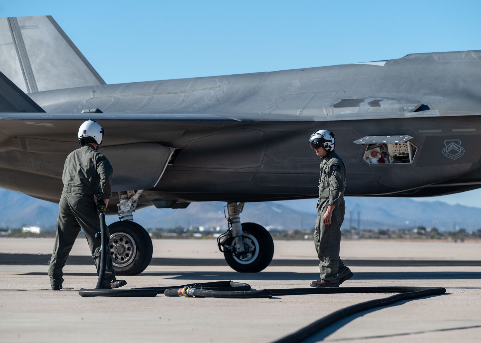 U.S. Marines refuel an F-35 Lightning II aircraft, assigned to the 56th Fighter Wing’s 62nd Fighter Squadron, on the flightline at Davis-Monthan Air Force Base, Arizona, Nov. 14, 2024. The Marines and F-35s participated in Exercise Desert Hammer 25-1, to include a forward area refueling point training. (U.S. Air Force photo by Senior Airman William Finn V)