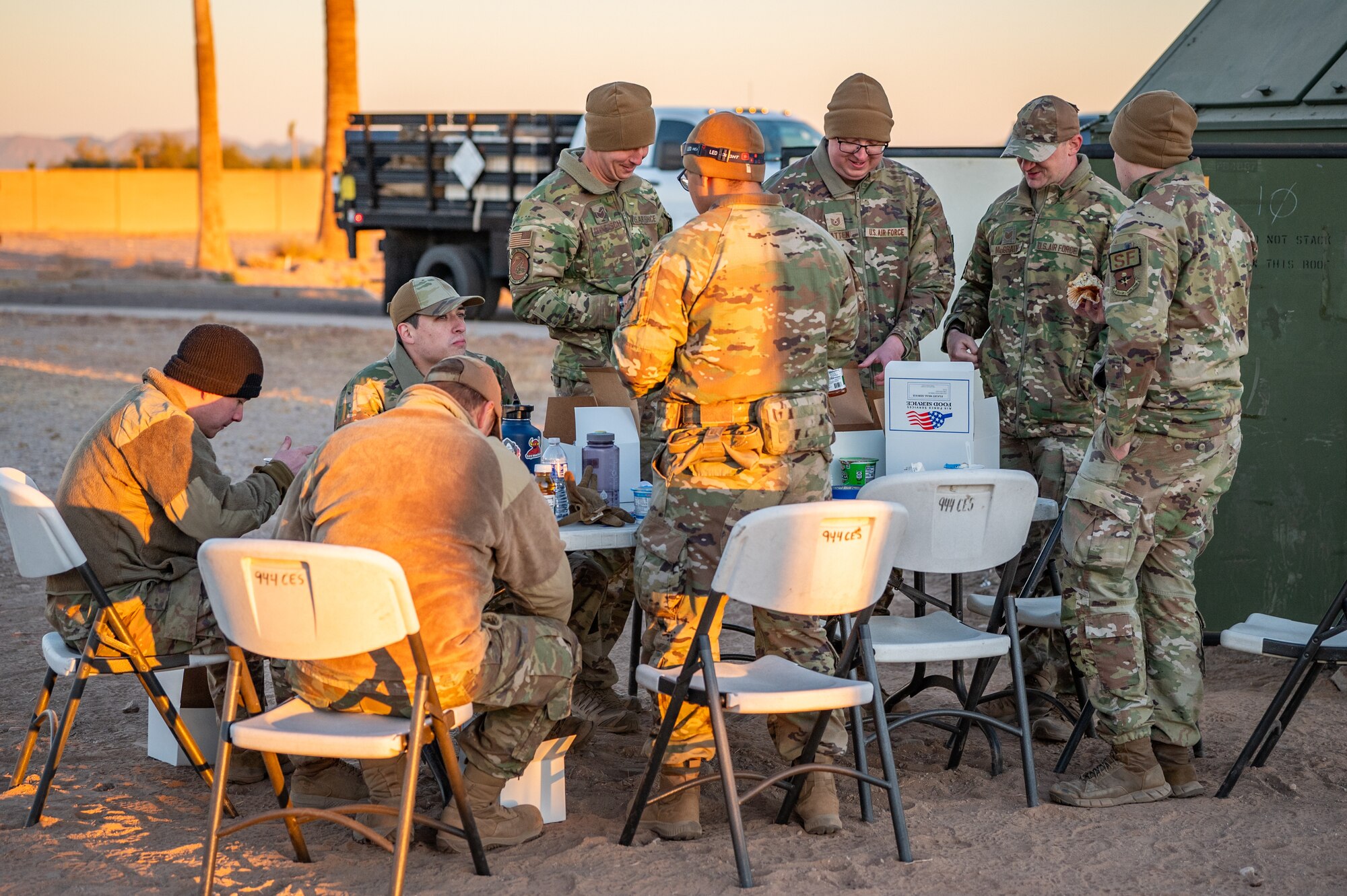 56th Fighter Wing active-duty Airmen gather for breakfast during Exercise Desert Hammer 25-1 at Gila Bend Air Force Auxiliary Field, Ariz., Nov. 14, 2024. Through joint and multinational collaboration, Desert Hammer tests the ability of over 700 participants and 131 aircraft to operate, defend, and sustain airbases under austere conditions. (U.S. Air Force photo by Tech. Sgt. Tyler J. Bolken)