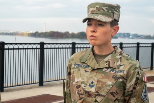 U.S. Space Force Sgt. Jordan Dunkerson, Honor Guard training flight 25-A student, stands at attention at the riverfront on Joint Base Anacostia-Bolling, Washington, D.C, Nov. 20, 2024. A training flight class lasts for 40 days or 280 training hours and on average holds 15 students. (U.S. Air Force photo by Staff Sgt. Demond Mcghee)