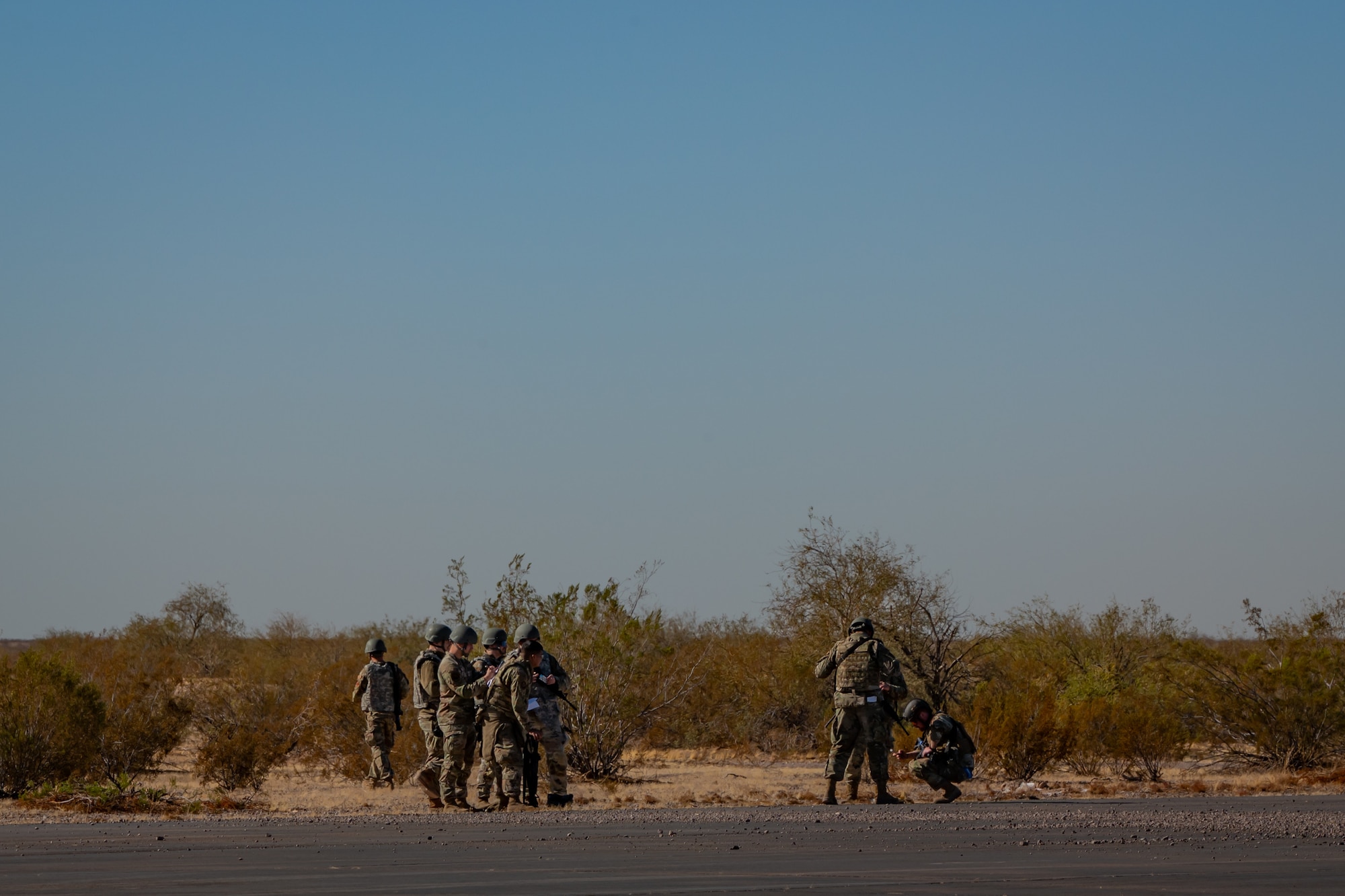 944th Fighter Wing Reserve Citizen Airmen monitor the release of cargo from a U.S. Marine Corps KC-130J Hercules during Exercise Desert Hammer 25-1 at Auxiliary Airfield 6 near Gila Bend, Ariz., Nov. 14, 2024. Through joint and multinational collaboration, Desert Hammer tests the ability of over 700 participants and 131 aircraft to operate, defend, and sustain airbases under austere conditions. (U.S. Air Force photo by Tech. Sgt. Tyler J. Bolken)