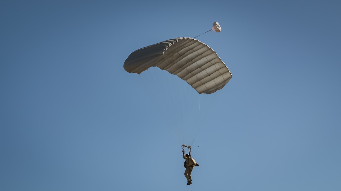 A U.S. Air Force Airman touches down at the landing zone during Exercise Desert Hammer 25-1 at Auxiliary Airfield 6 near Gila Bend, Ariz., Nov. 14, 2024. Exercise Desert Hammer 25-1 emphasizes the U.S. Air Force Reserve’s commitment to readiness by integrating Agile Combat Support and Large Force Exercise capabilities in a contested environment. (U.S. Air Force photo by Tech. Sgt. Tyler J. Bolken)