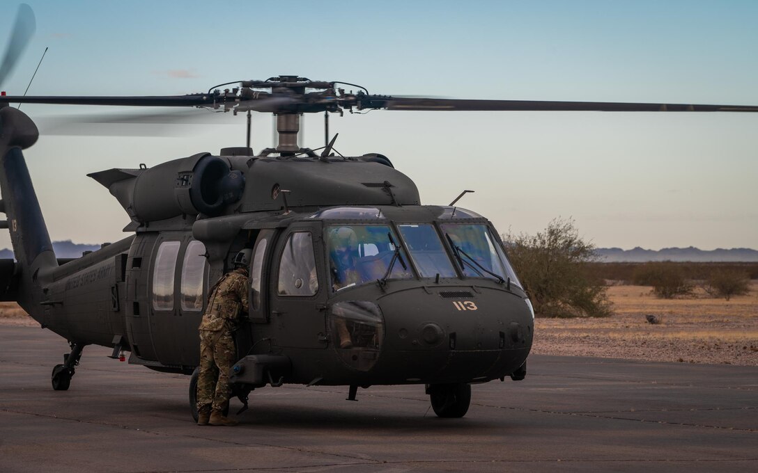 An Arizona Army National Guard UH-60 Black Hawk Helicopter prepares to take off as part of Critical Care Air Transport Team (CCATT) training during Exercise Desert Hammer 25-1 at Auxiliary Field 6 near Gila Bend, Ariz., Nov. 16, 2024. This large-scale exercise showcases the adaptability of Mission Ready Airmen, advancing the skills needed to thrive in the rapidly evolving challenges of global competition. (U.S. Air Force photo by Senior Airman Jacob Dastas)