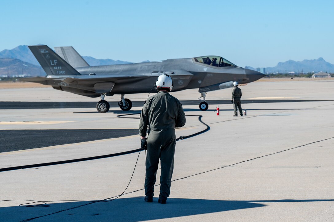 U.S. Marines refuel an F-35 Lightning II aircraft, assigned to the 56th Fighter Wing’s 62nd Fighter Squadron, on the flightline at Davis-Monthan Air Force Base, Ariz., Nov. 14, 2024. The Marines and F-35s participated in Exercise Desert Hammer 25-1, to include a forward area refueling point training. (U.S. Air Force photo by Senior Airman Devlin Bishop)