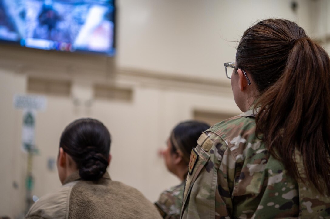 944th Fighter Wing Reserve Citizen Airmen review video footage as part of a Ready Start Brief during Exercise Desert Hammer 25-1 at Luke Air Force Base, Ariz., Nov. 13, 2024. Exercise Desert Hammer 25-1 emphasizes the U.S. Air Force Reserve’s commitment to readiness by integrating Agile Combat Support and Large Force Exercise capabilities in a contested environment. (U.S. Air Force photo by Senior Airman Jacob Dastas)