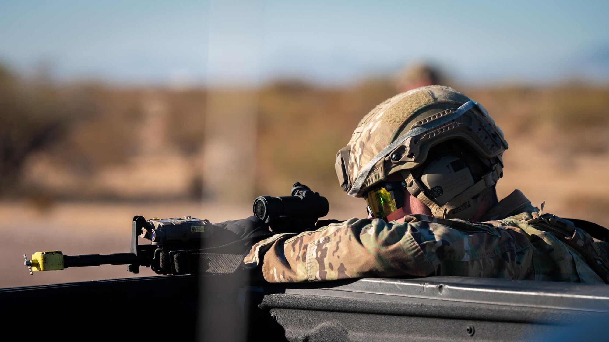 A 944th Fighter Wing U.S. Air Force Reserve Citizen Airman takes aim from a secure position during Exercise Desert Hammer 25-1 at Auxiliary Airfield 6 near Gila Bend, Ariz., Nov. 14, 2024. This large-scale exercise showcases the adaptability of Mission Ready Airmen, advancing the skills needed to thrive in the rapidly evolving challenges of global competition. (U.S. Air Force photo by Senior Airman Jacob Dastas)