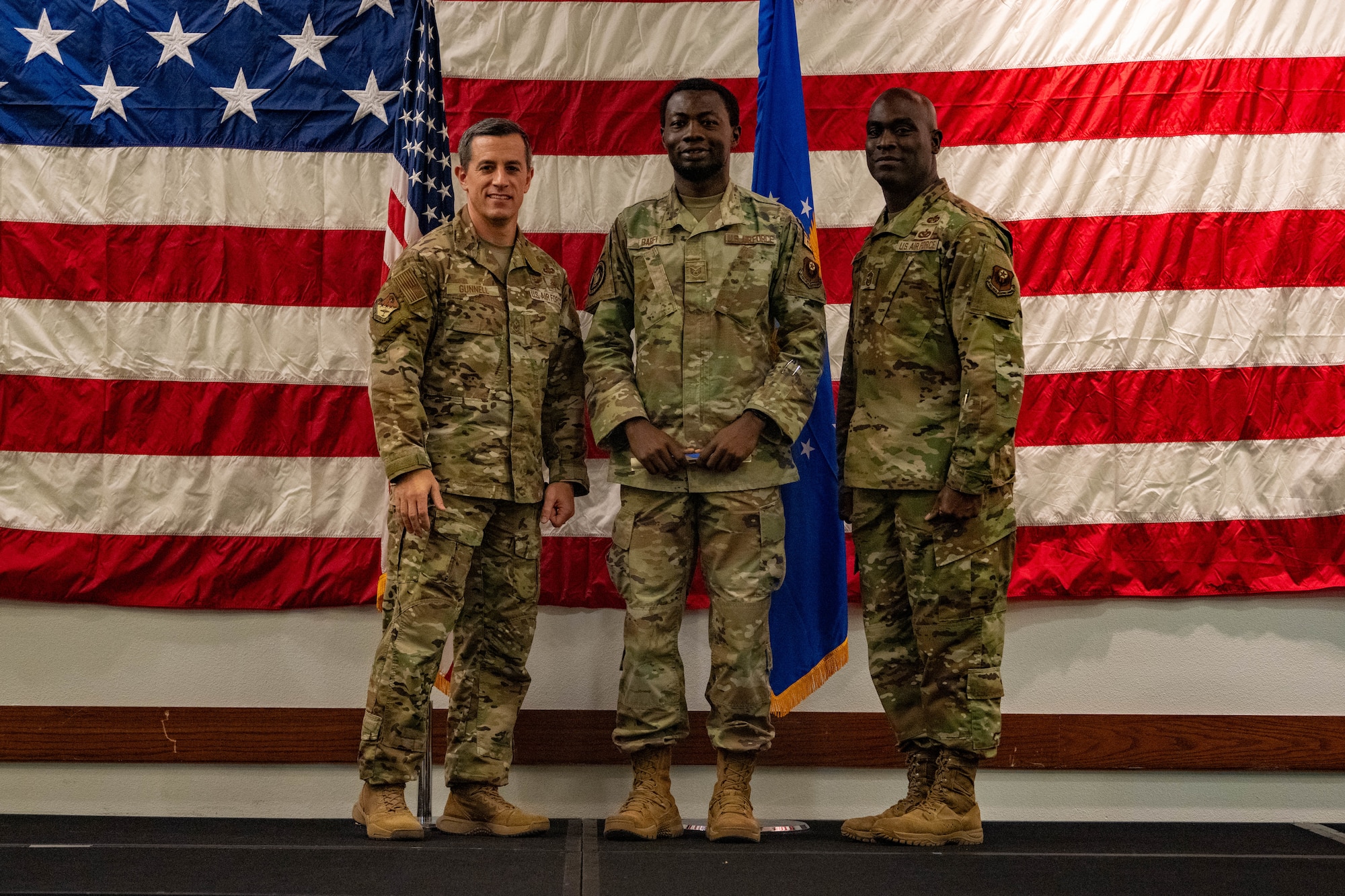 An Airman poses with leadership