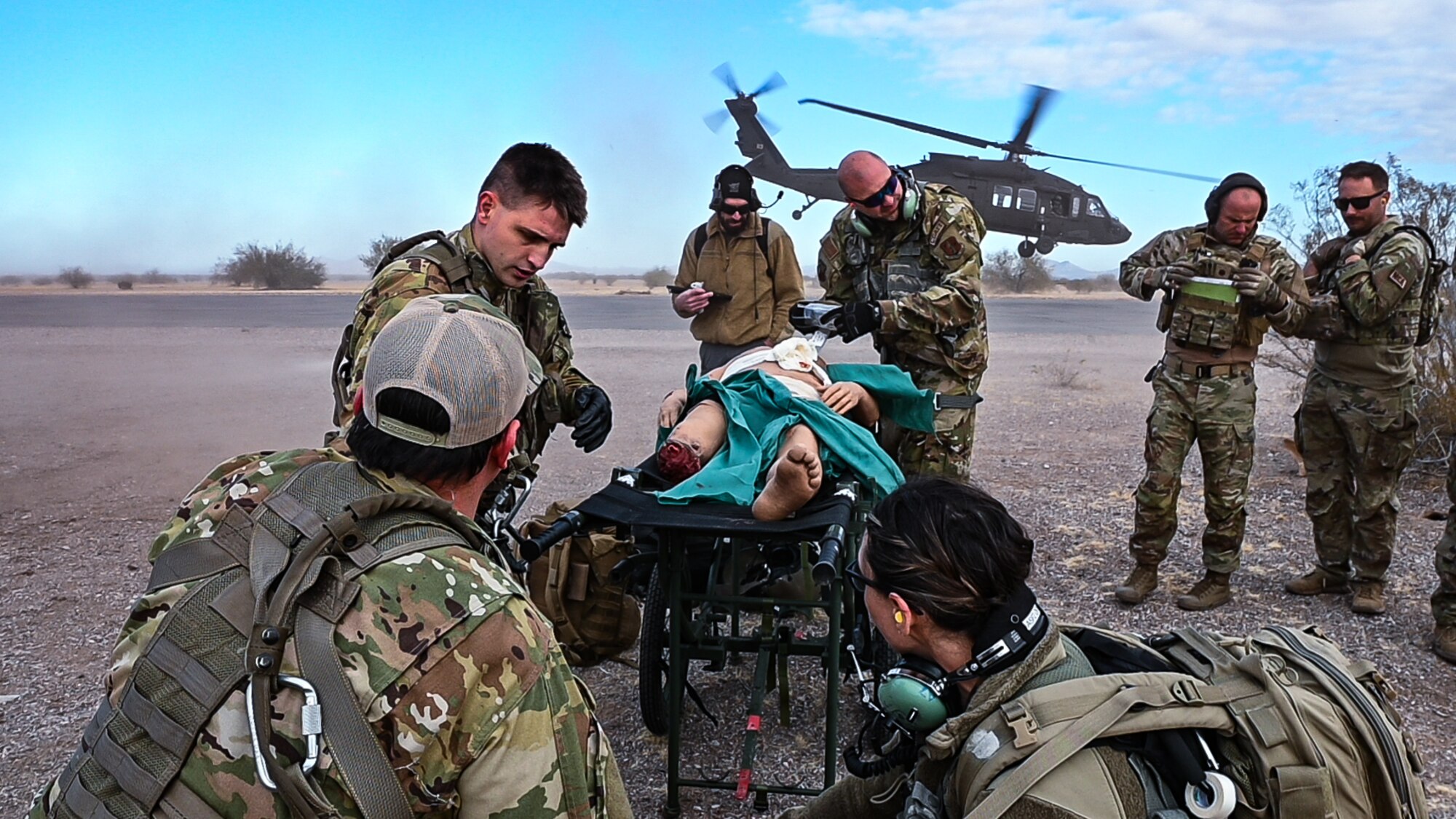 944th Fighter Wing U.S. Air Force Reserve Citizen Airmen and Arizona Army National Guard Soldiers provide tactical medical care during Exercise Desert Hammer 25-1 at Auxiliary Field 6 near Gila Bend, Ariz., Nov. 16, 2024. Through joint and multinational collaboration, Desert Hammer tests the ability of over 700 participants and 131 aircraft to operate, defend, and sustain airbases under austere conditions. (U.S. Air Force photo by Senior Airman Alexis Orozco)