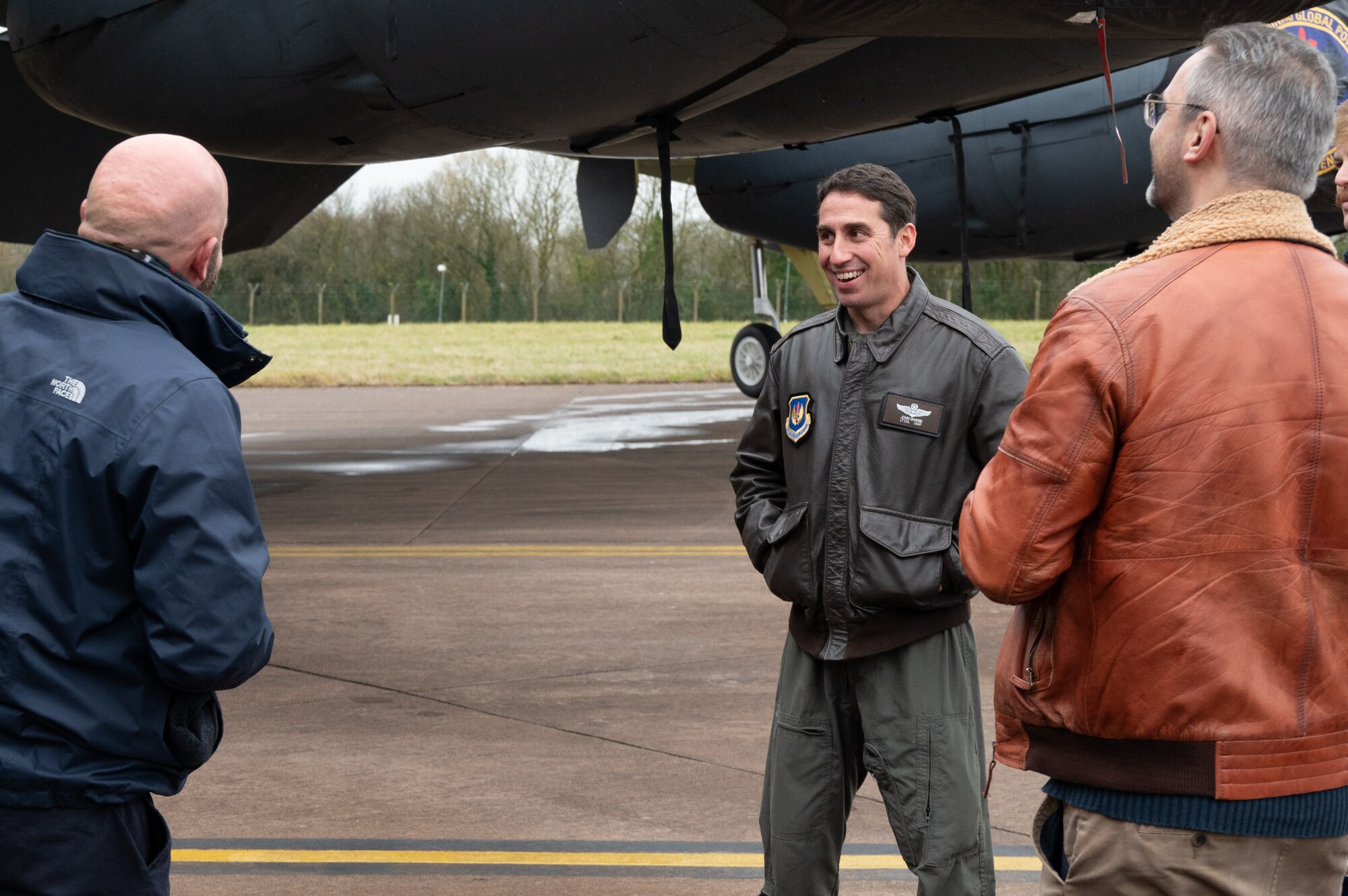 U.S. Air Force Lt. Col. John Gharbi, 420th Air Base Squadron Assistant Director of Operations talks with guests