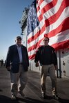 SECNAV Carlos Del Toro and former California Gov. Arnold Schwarzenegger attend an all-hands call aboard USS Boxer (LHD 4) at Naval Base San Diego.