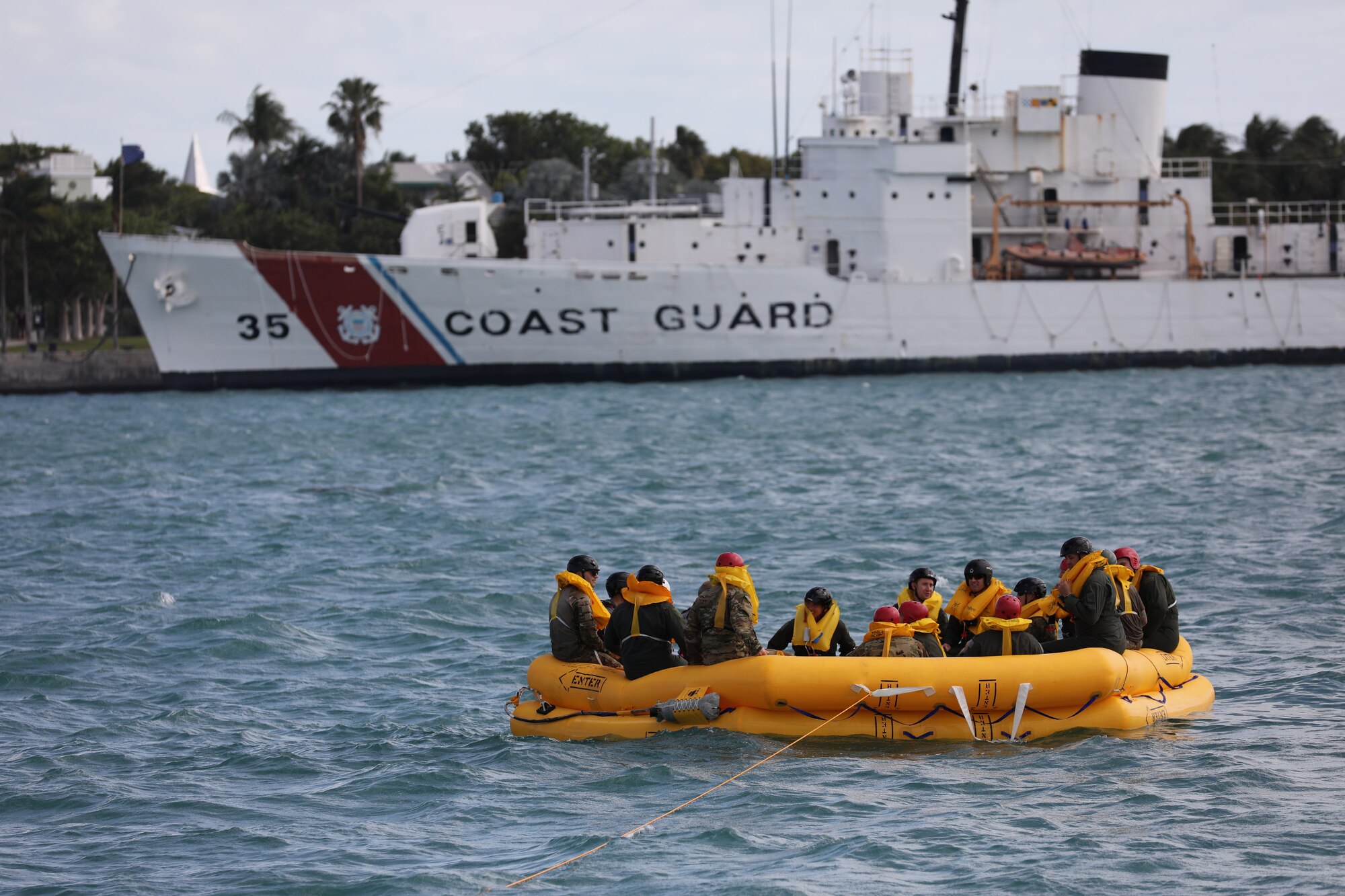 Reservists from the 445th Operation Group’s 89th Airlift Squadron, 445th Aeromedical Evacuation Squadron and 445th Operations Support Squadron float in a 46-man life raft as they participate in water survival training with the U.S. Naval Air Station Key West Search and Rescue, Sector Key West Coast Guard and Key West Police Department in Key West, Florida Nov. 21, 2024. Over 80 reservists from Ops, 445th Maintenance Group, 445th Mission Support Group and 445th Airlift Wing medical squadrons participated in or provided support for the joint training event Nov. 21-22, 2024. Training included water survival and urban survival, evasion, resistance and escape. AES Airmen also conducted training flights to fulfill their training requirements. (U.S. Air Force photo/Senior Airman Angela Jackson)