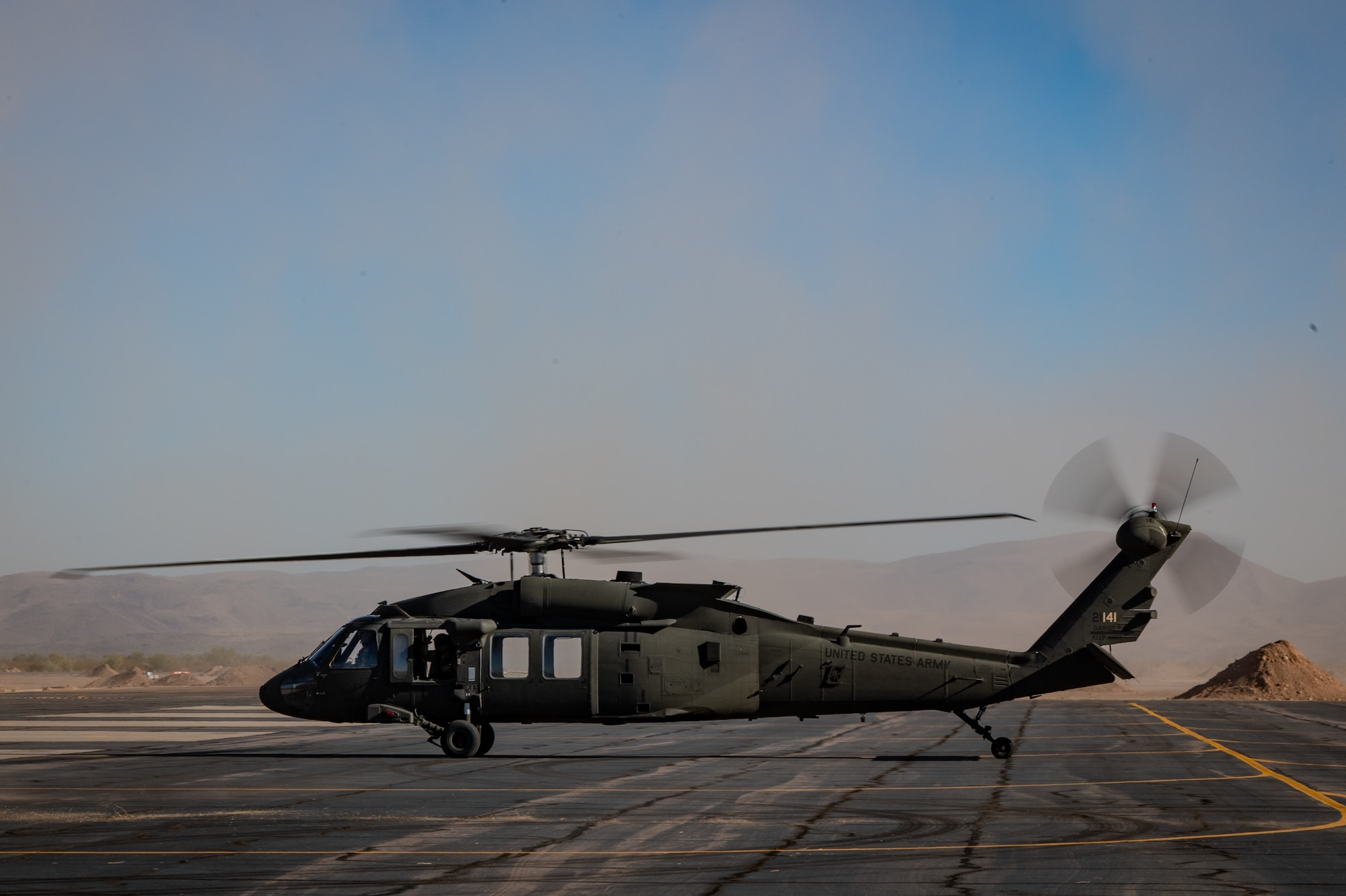 An Arizona Army National Guard UH-60 Black Hawk taxis in from its landing during Exercise Desert Hammer 25-1 at Gila Bend Air Force Auxiliary Field near Gila Bend, Ariz., Nov. 14, 2024. Through joint and multinational collaboration, Desert Hammer tests the ability of over 700 participants and 131 aircraft to operate, defend, and sustain airbases under austere conditions. (U.S. Air Force photo by Tech. Sgt. Tyler J. Bolken)