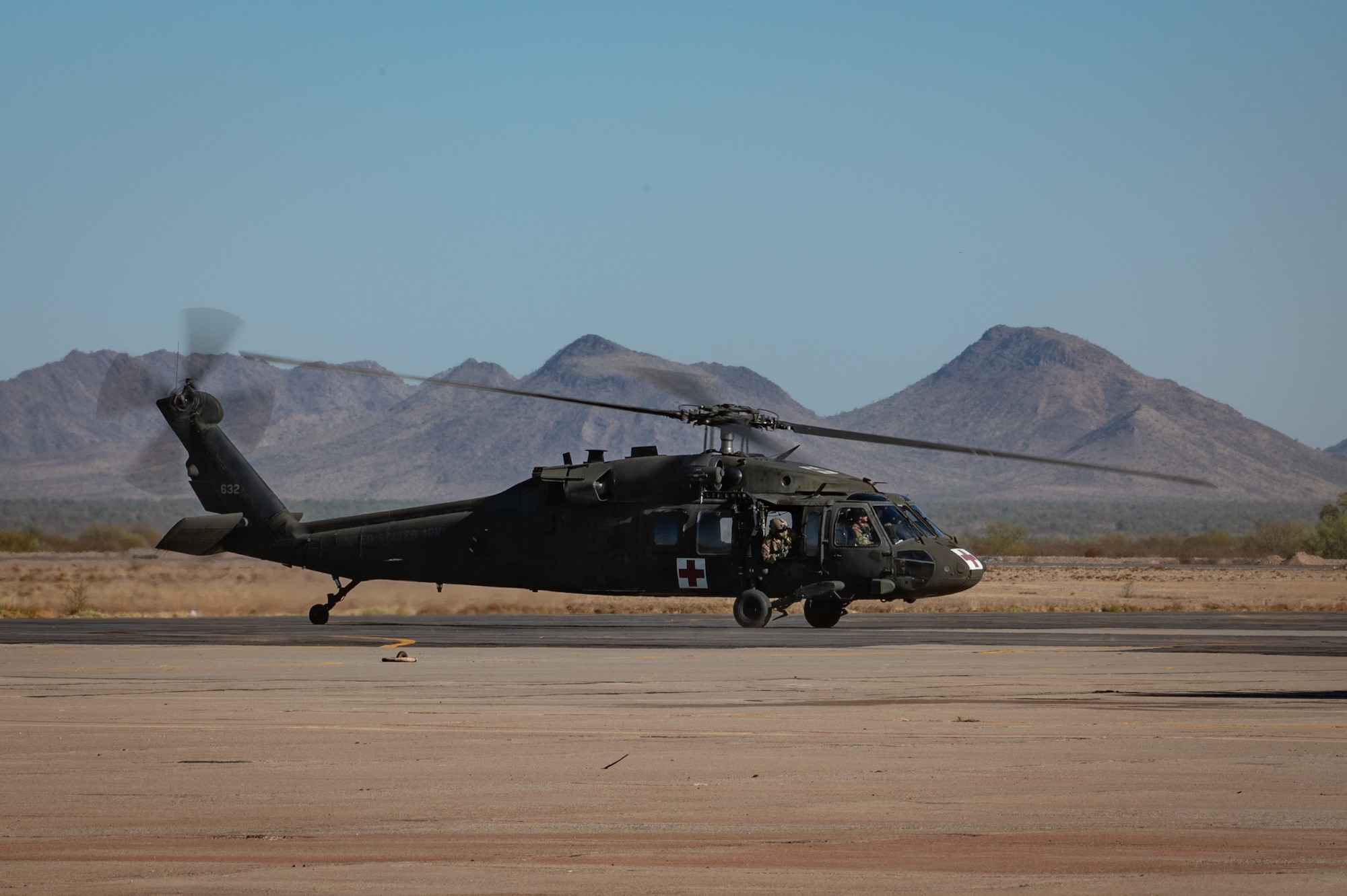 An Arizona Army National Guard UH-60 Black Hawk lands during Exercise Desert Hammer 25-1 at Gila Bend Air Force Auxiliary Field near Gila Bend, Ariz., Nov. 14, 2024. Set against the unmatched backdrop of the Barry M. Goldwater Range, Desert Hammer leverages Arizona’s strategic geography to provide realistic combat training for U.S. and allied forces. (U.S. Air Force photo by Tech. Sgt. Tyler J. Bolken)
