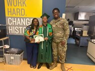PFC Michael Romulus with his mother at his younger brother's graduation from middle school.