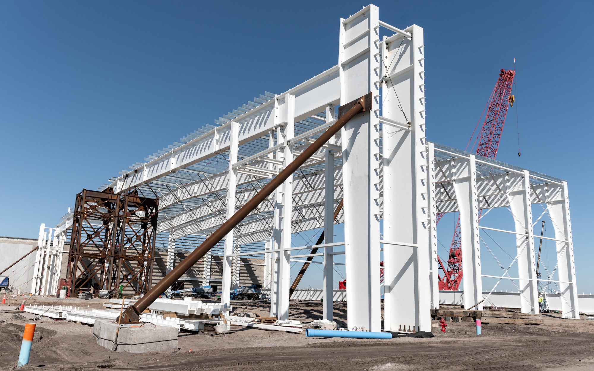 The structural frame of the QF-16 Full-Scale Aerial Targets hangar is in progress