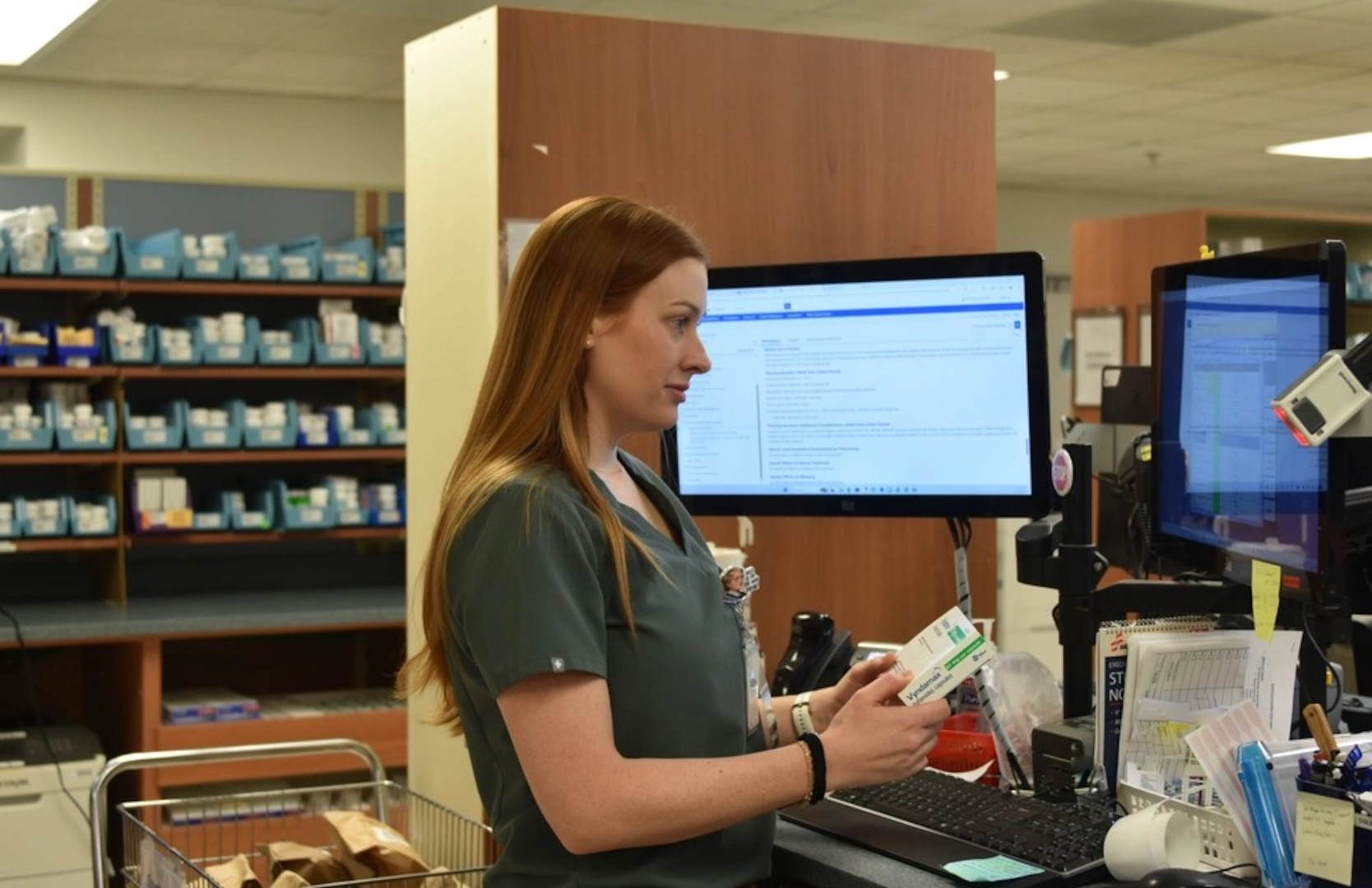 Womack Pharmacist, Kaitlin Guertin completes product verification on refills that were called in. Guertin is verifying the right drug was pulled to fill the order, the directions are correct, and no potential drug interactions with the patient’s other medications, November 20, 2024.