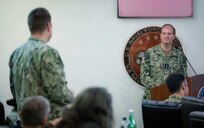 Adm. Stuart Munsch, commander, U.S. Naval Forces Europe-Africa (NAVEUR-NAVAF), takes a question during his opening remarks at the U.S. Maritime Security Cooperation and Attaché Symposium (USMSCAS), in Naples, Italy, Dec. 3, 2024. NAVEUR-NAVAF hosted more than 80 U.S. Navy and Marine Corps attachés, Personnel Exchange Program Officers, and U.S. 6th Fleet liaison officers stationed throughout Europe and Africa at the annual symposium.