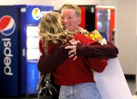 Staff Sgt. Kailee Goldsworthy hugs family and friends after arriving at Abraham Lincoln Capital Airport in Springfield, Illinois Nov. 21.