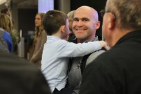 Maj. Kevin Spears hugs family and friends after arriving at Abraham Lincoln Capital Airport in Springfield, Illinois Nov. 21.