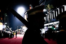 U.S. Marine Corps Cpl. Juan Perez, 2nd Battalion 23rd Marines 4th Marine Division, participates in the 92nd Hollywood Parade in Hollywood, California, Dec. 1, 2024. Marines participated in the parade to improve community relations, increase morale, and demonstrate holiday spirit. (U.S. Marine Corps photo by Cpl. Sarah M. Grawcock)