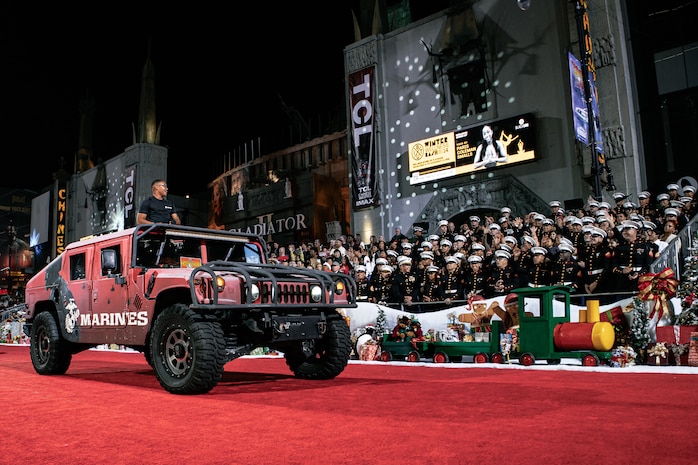 U.S. Marine Corps Enhanced Marketing Vehicle Operator Cpl. Ed VelazquezPerez, with 12th Marine Corps District, participates in the 92nd Hollywood Parade in Hollywood, California, Dec. 1, 2024. Marines participated in the parade to improve community relations, increase morale, and demonstrate holiday spirit. (U.S. Marine Corps photo by Cpl. Sarah M. Grawcock)