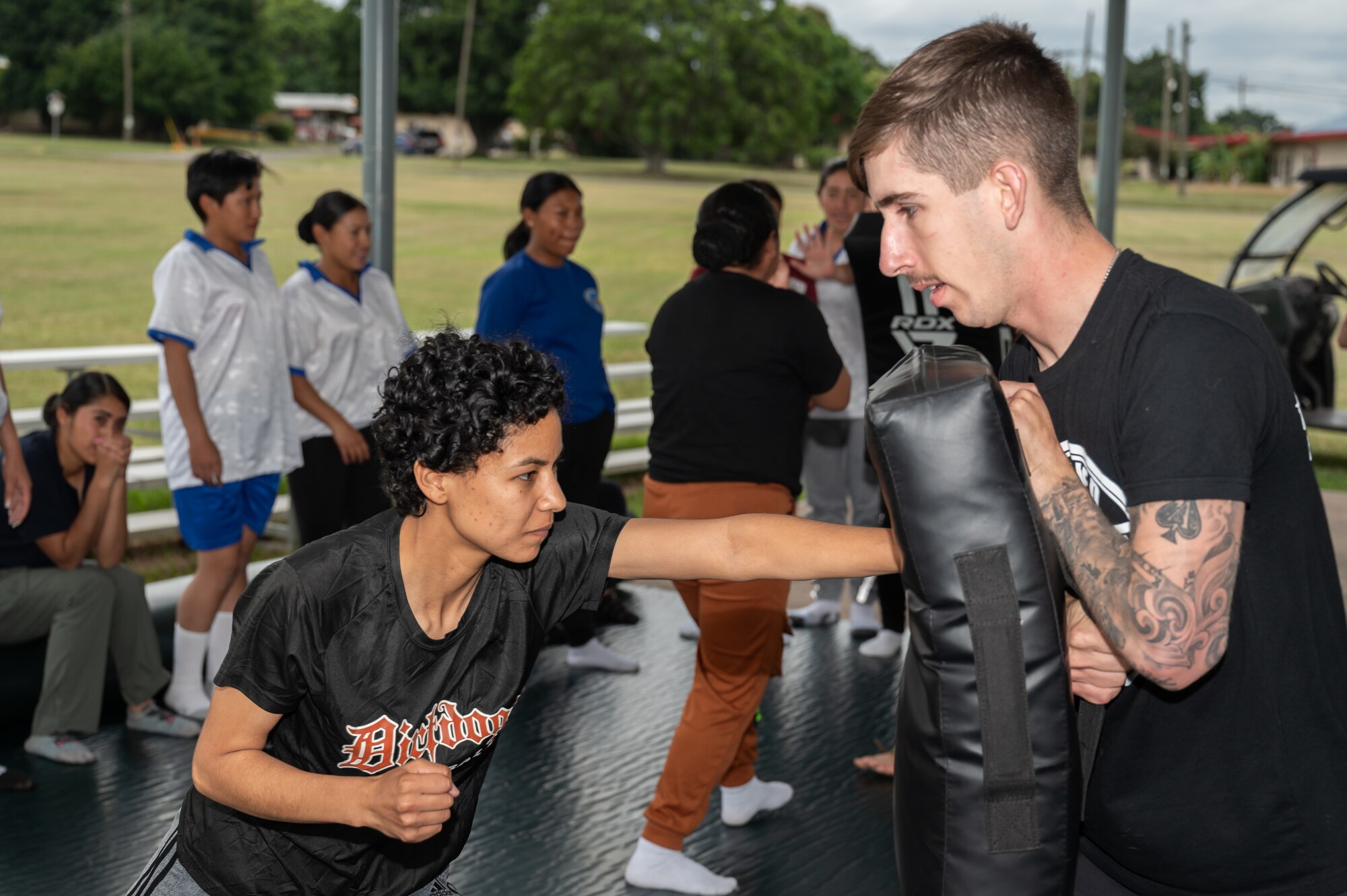 U.S. Army Staff Sgt. Francisco Ledesma, Army Forces Command, Joint Task Force-Bravo, teaches a Honduran Air Force service member combatives during the EmpowerHER combatives class at Soto Cano Air Base, Honduras, Dec. 3, 2024.
