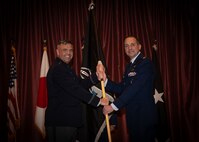 Military leaders exchange flag