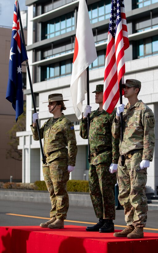 he combined color guard for Yama Sakura 87, comprised of the Australian Defence Force, the Japan Ground Self-Defense Force, and the U.S. Army, posts the national colors during the opening ceremony rehearsal at Camp Asaka, Japan, Dec. 5, 2024.