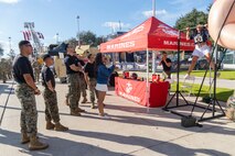 U.S. Marines with Recruiting Station Houston, 8th Marine Corps District, watch an attendee conduct pull-ups during the Houston Texans vs. Tennessee Titans football game at NRG Stadium in Houston, Texas, Nov. 24, 2024. The Marines challenged fans and attendees with a pull-up challenge to win prizes to support the National Football League's Salute To Service game along with the other military branches. (U.S. Marine Corps photo by Sgt. Ryan H. Pulliam)