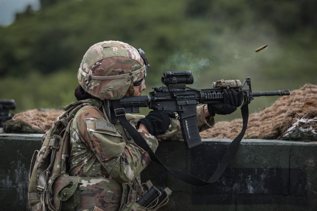 U.S. Army soldier, Pfc. Andrea Flores, assigned to 4-70th Armor Regiment, 1st Armored Division, fires an M4 Carbine during a team live fire exercise at Nightmare Range, near Pocheon, South Korea, August 3, 2024.