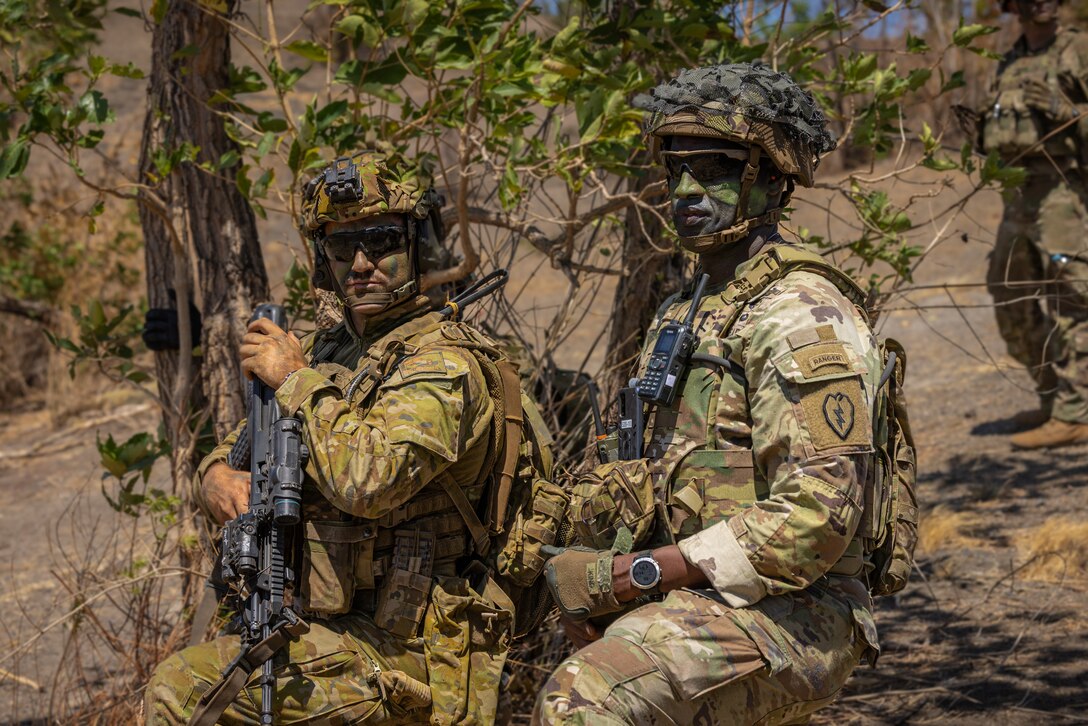 U.S. Army Col. Adisa King, commander of 3rd Brigade, 25th Infantry Division, and an Australian Armed Forces soldier, watch a UH-60 Blackhawk land during a combined arms live fire exercise at Super Garuda Shield 2024 in Puslatpur 5, Indonesia, Sept. 6, 2024.