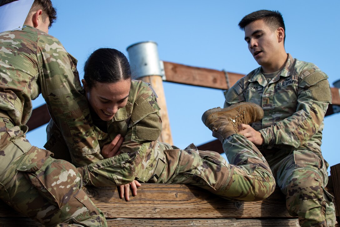 Soldiers from the 593rd Expeditionary Sustainment Command compete in an obstacle course during the Rest Assured Challenge at Joint Base Lewis-McChord, Washington, Sept. 27, 2024.