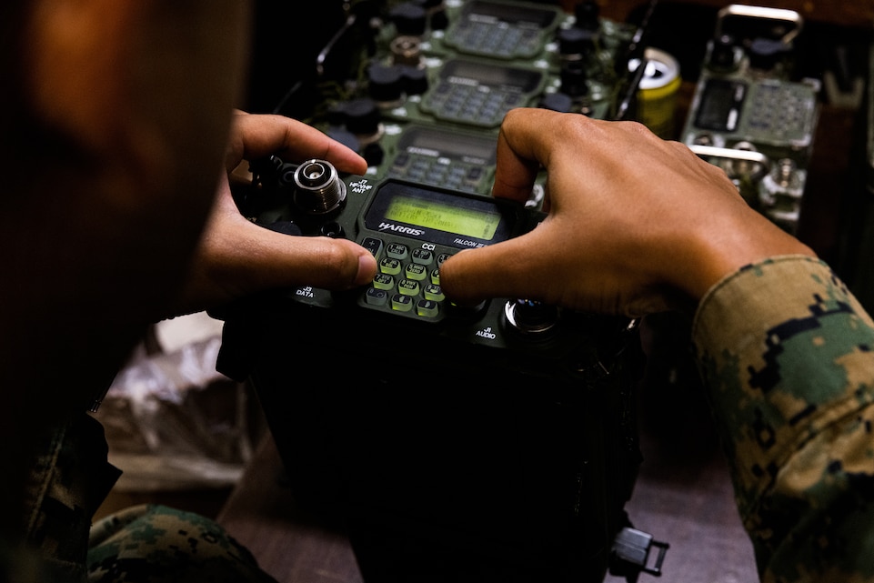 U.S. Marine Corps Cpl. Sergio Rios, a system repairer with the 31st Marine Expeditionary Unit, sets up a radio system during a communication exercise at Camp Hansen, Okinawa, Japan, Nov. 19, 2024. Marines with the 31st MEU were paired with instructors from Deploying Group Systems Integration Testing to ensure that the Marines are efficient in functioning Command, Control, Communications and Computer equipment and are prepared for real-world contingencies. The 31st MEU, the Marine Corps’ only continuously forward-deployed MEU, provides a flexible and lethal force, ready to perform a wide range of military operations as the premiere crisis response force in the Indo-Pacific region. Rios is a native of Nevada. (U.S. Marine Corps photo by Lance Cpl. Raul Sotovilla)