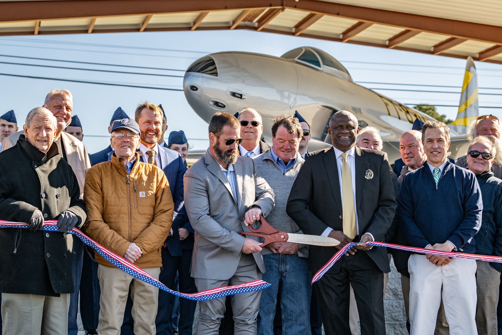 person is cutting a ribbon