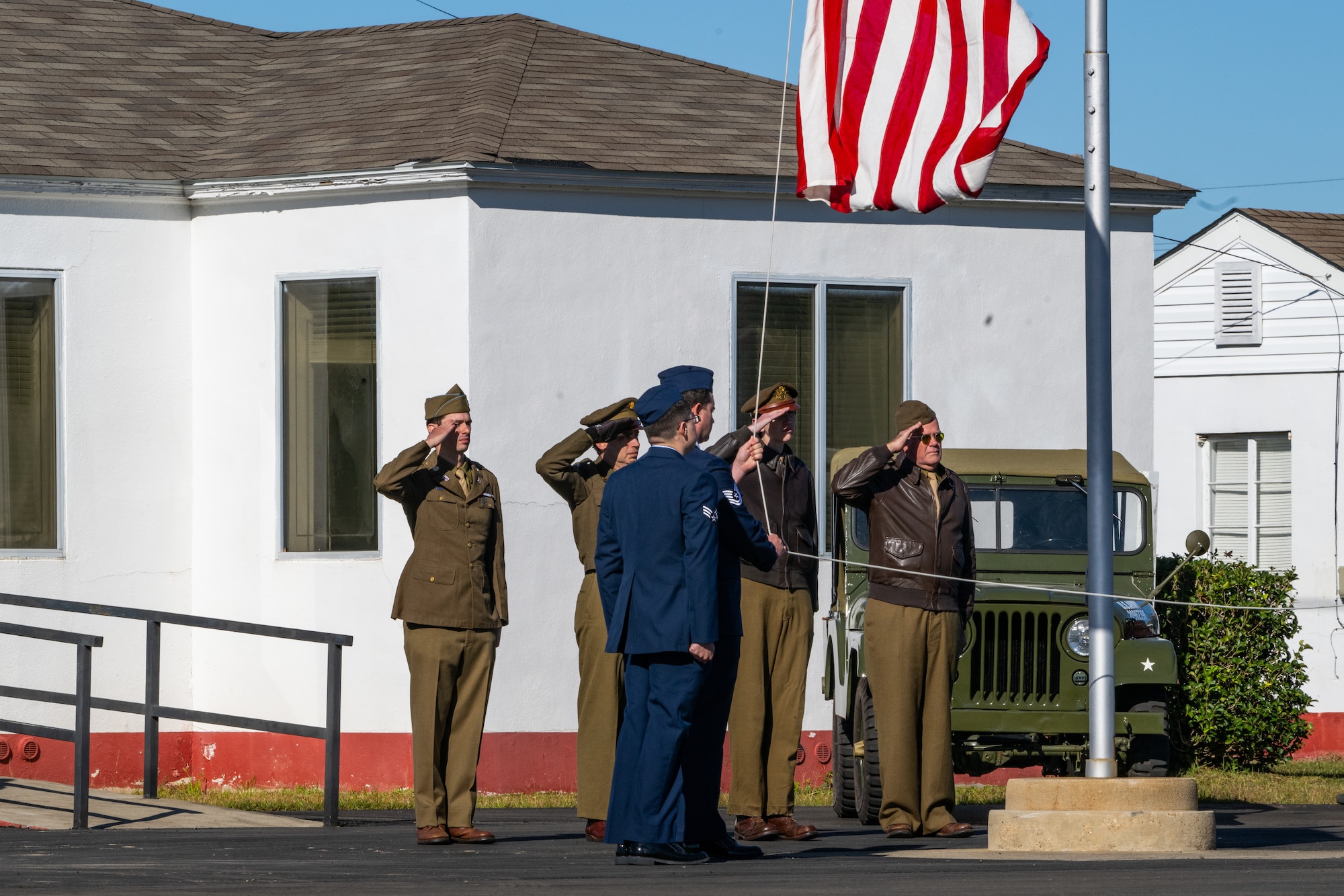 Airmen are raising a flag