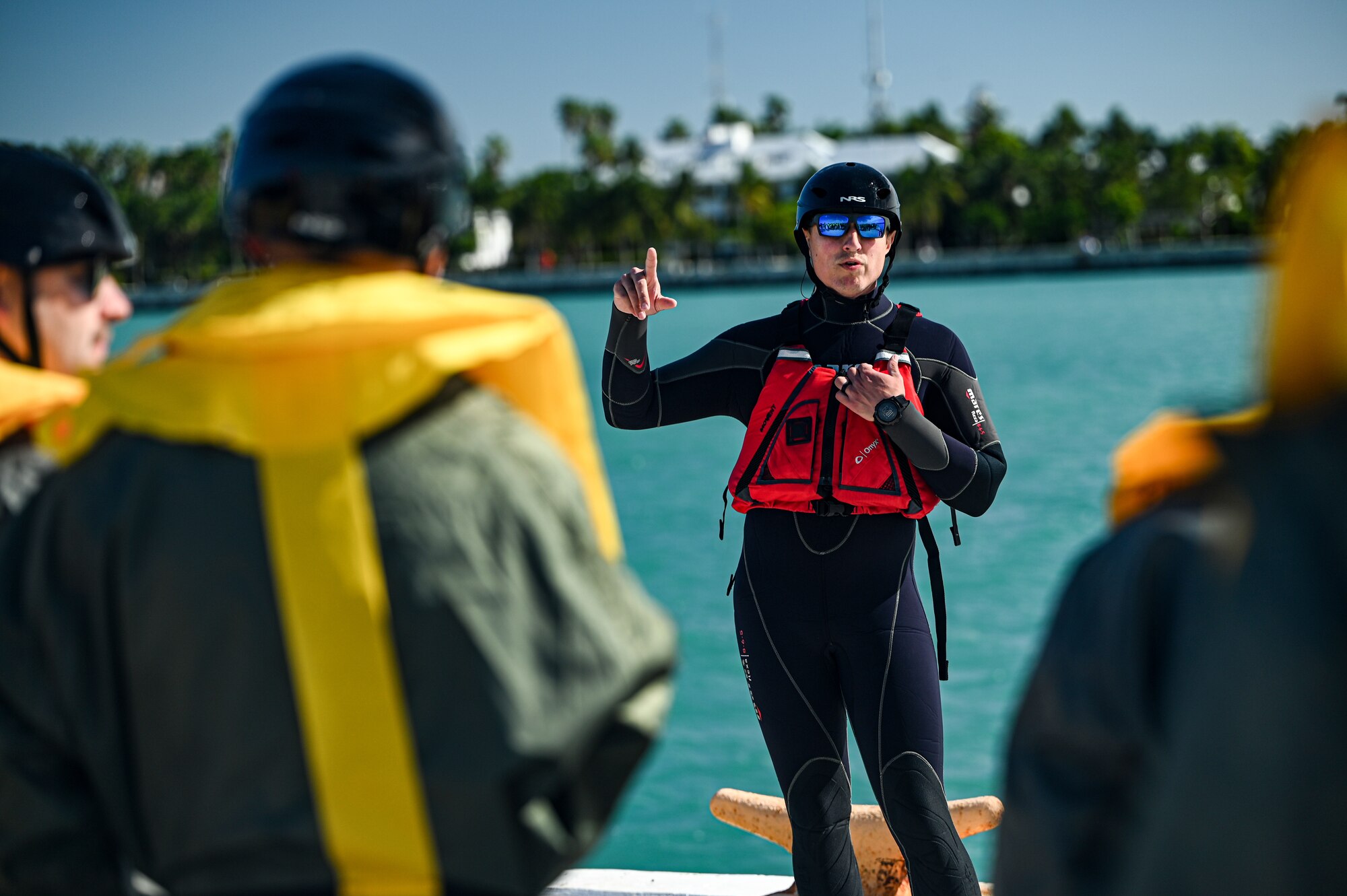 Master Sgt. Dustin Dobbs, 445th Operations Support Squadron survival, evasion, resistance, and escape specialist, briefs reservists from the 445th Operation Group’s 89th Airlift Squadron, 445th Aeromedical Evacuation Squadron and 445th Operations Support Squadron about water survival while participating with the U.S. Naval Air Station Key West Search and Rescue, Sector Key West Coast Guard and Key West Police Department in Key West, Florida Nov. 22, 2024. Over 80 reservists from Ops, 445th Maintenance Group, 445th Mission Support Group and 445th Airlift Wing medical squadrons participated in or provided support for the joint training event Nov. 21-22, 2024. Training included water survival and urban survival, evasion, resistance and escape. AES Airmen also conducted training flights to fulfill their training requirements.