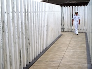 USS Oklahoma Memorial, located on Pearl Harbor, Hawaii, pictured in 2009. Each marble pillar represents one of the 429 crew members killed in the attack.
